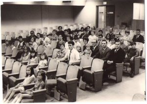 Adults and children gathered for worship in Chambers building on Penn State Campus